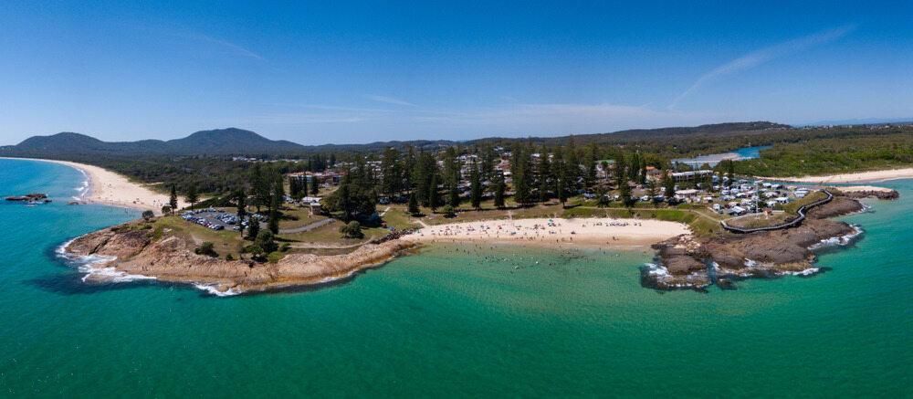 An Aerial View of a Small Island in the Middle of the Ocean — Patterson Glass Works in South West Rocks, NSW