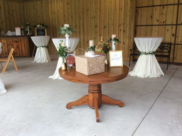 A table with a sign that says the bride on it