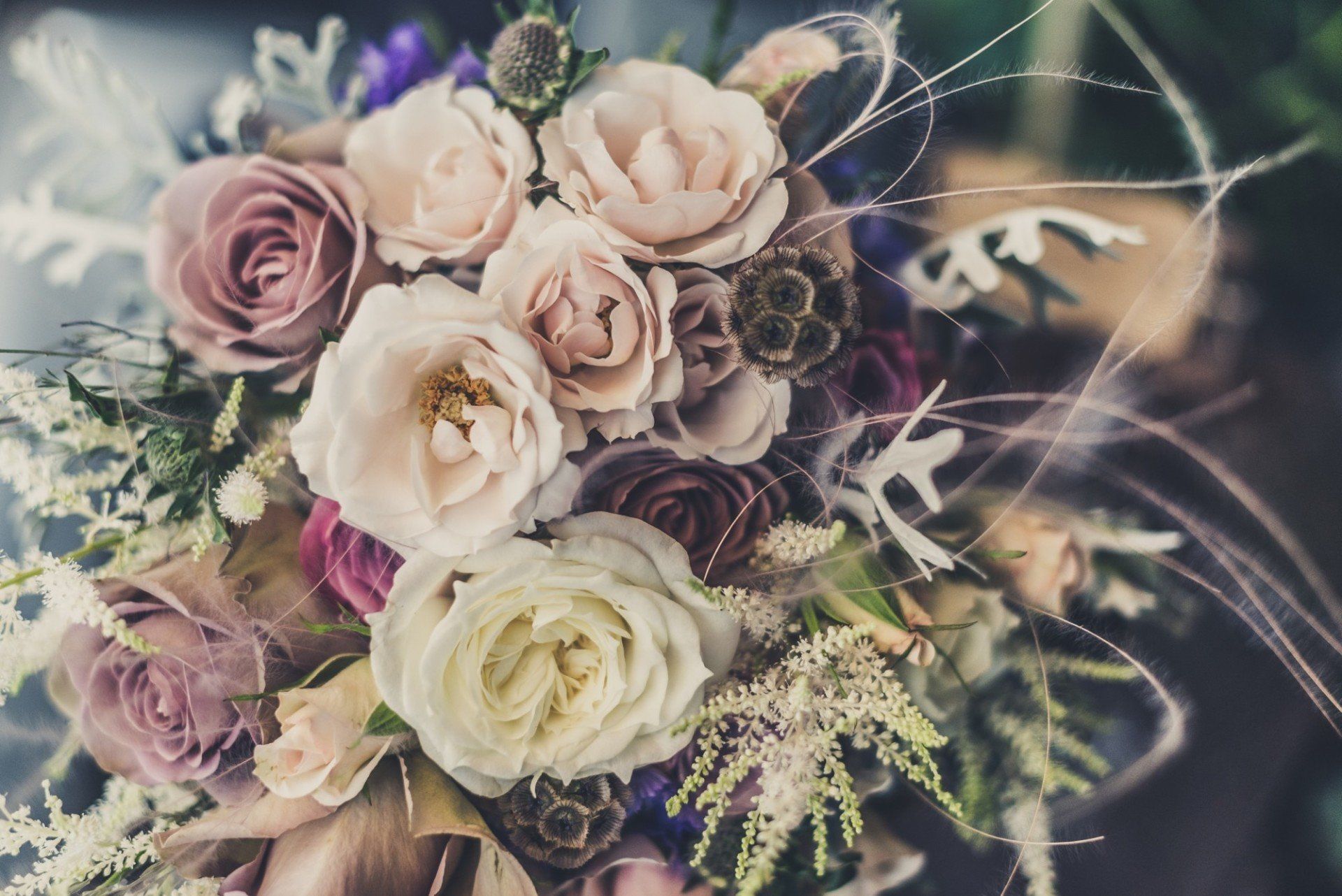 A close up of a bouquet of flowers on a table.