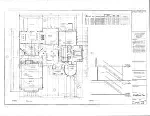 A black and white floor plan of a house with a staircase.
