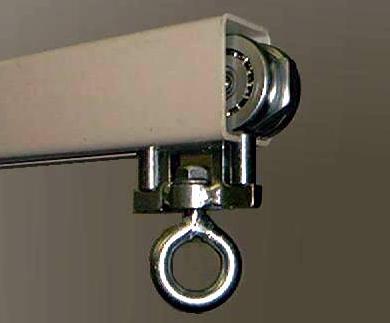 A close up of a curtain track with a hook attached to it.