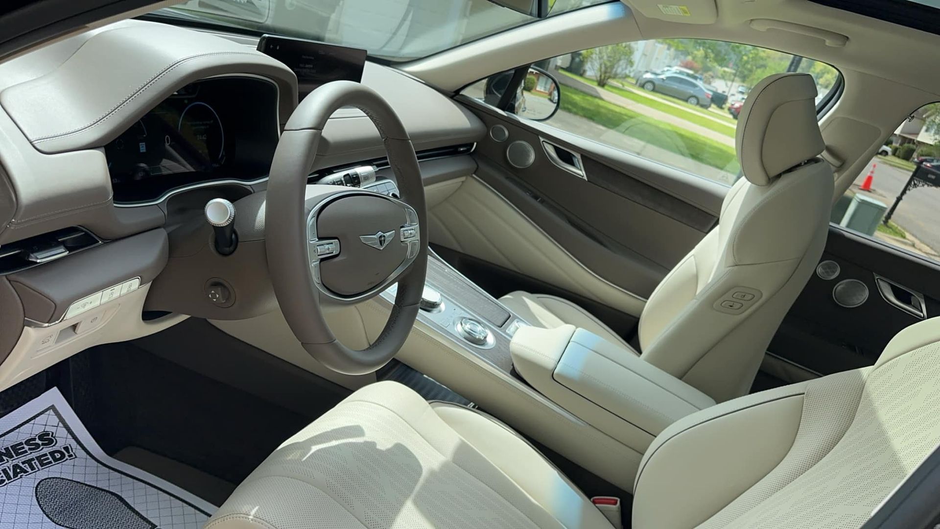 The interior of a car with a steering wheel and seats