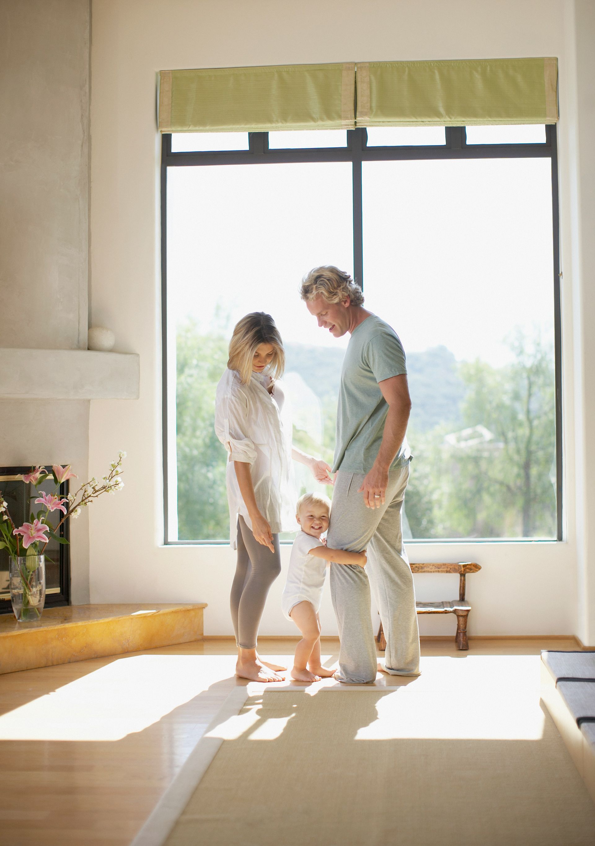 Red car with severe damage to the rear, loaded on a tow truck.