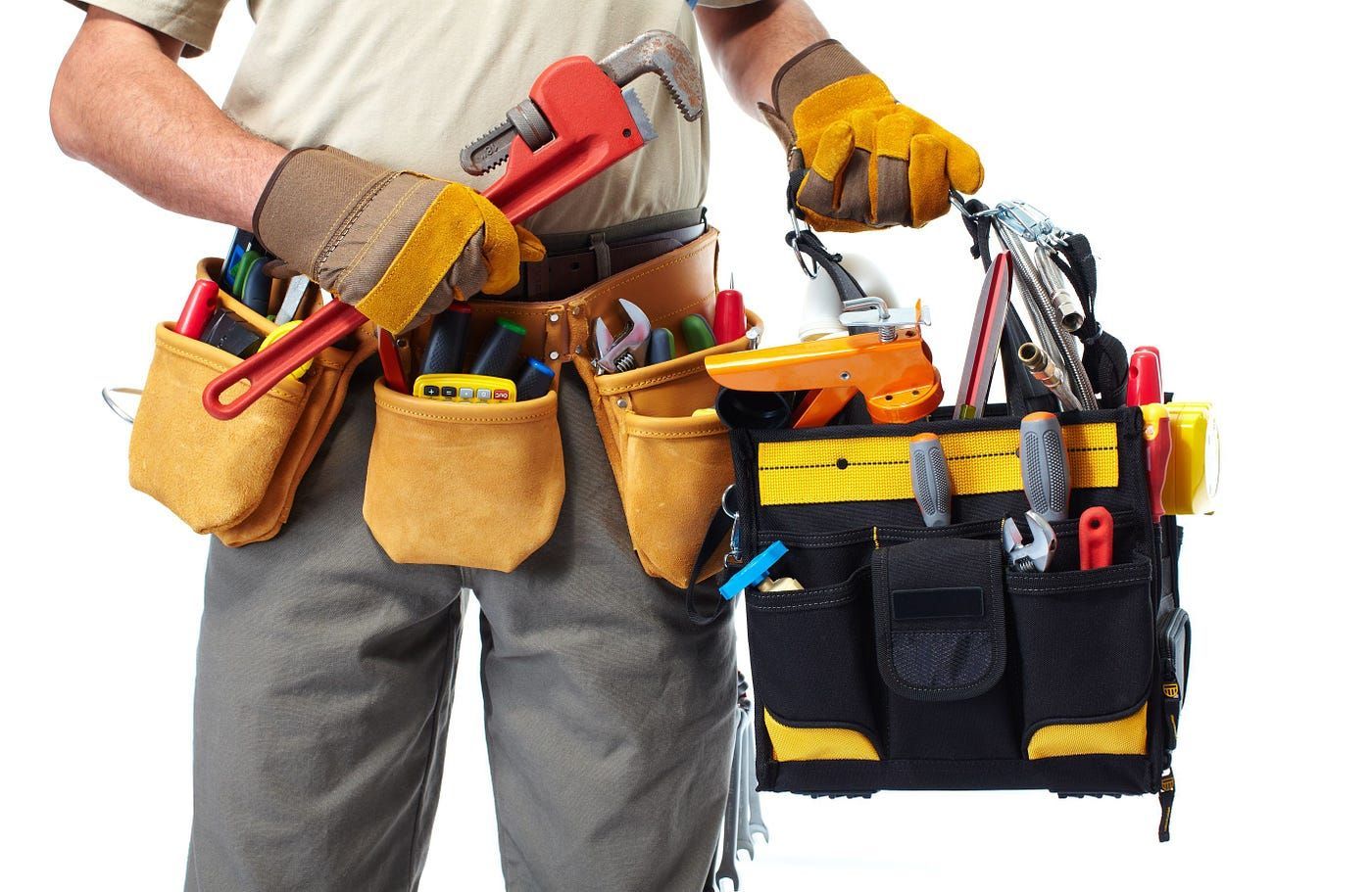 A man is holding a toolbox full of tools
