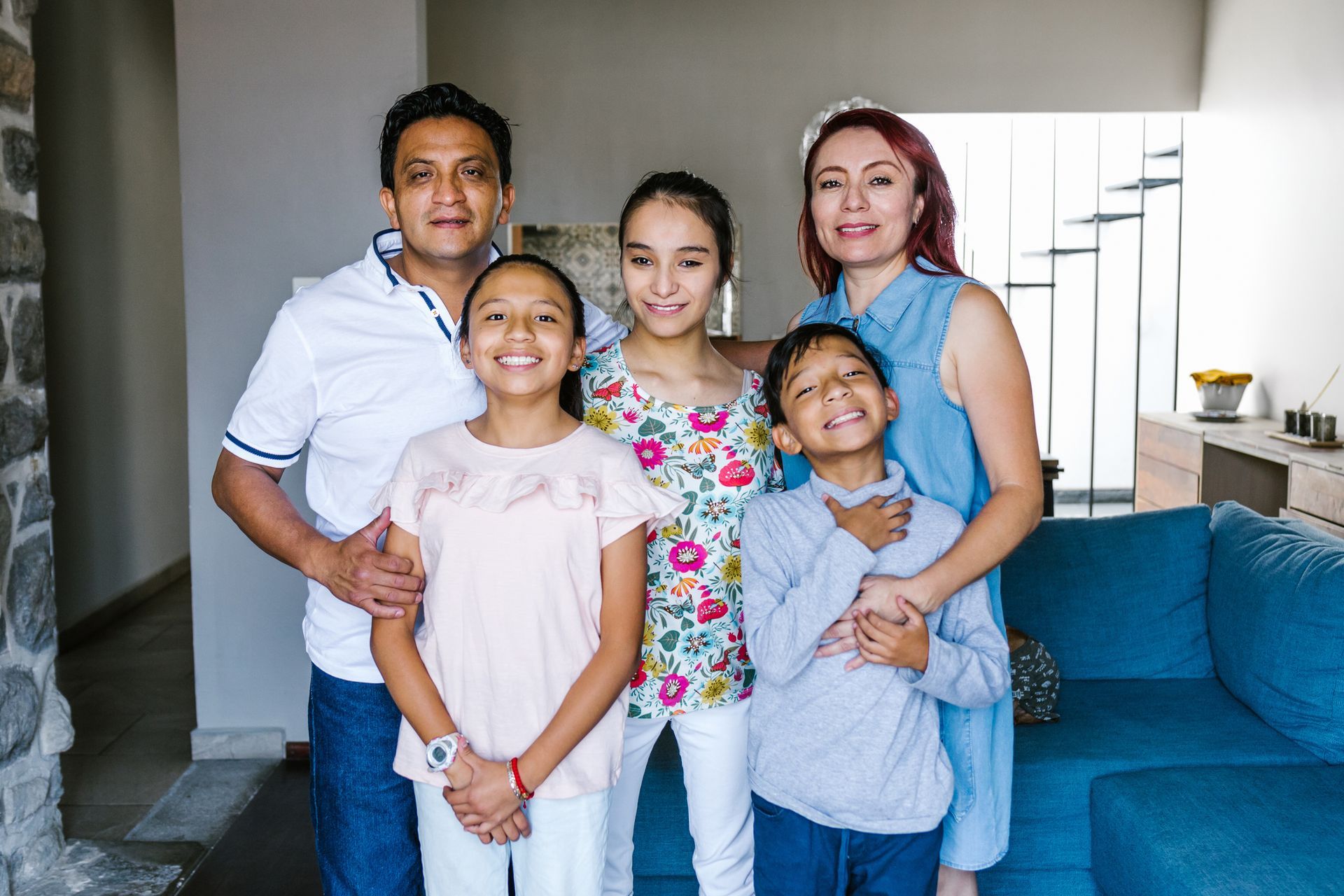 Two people are holding hands while sitting next to each other.