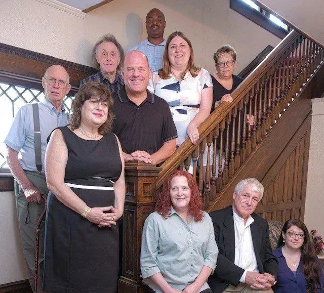 A group of people standing on a set of stairs