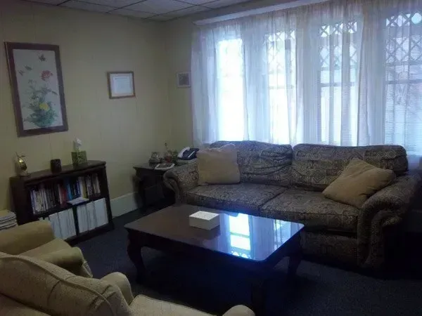 A living room with a couch and a coffee table