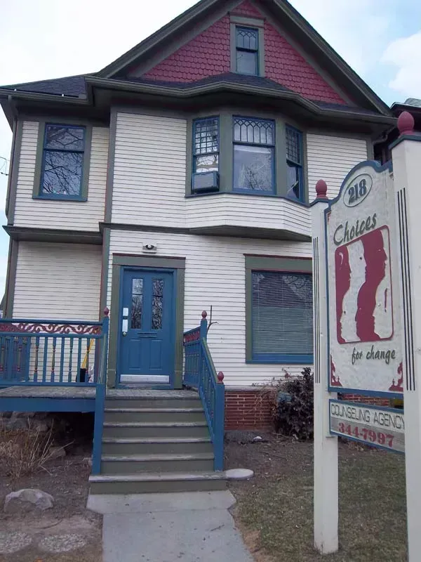 A house with a sign that says choices on it