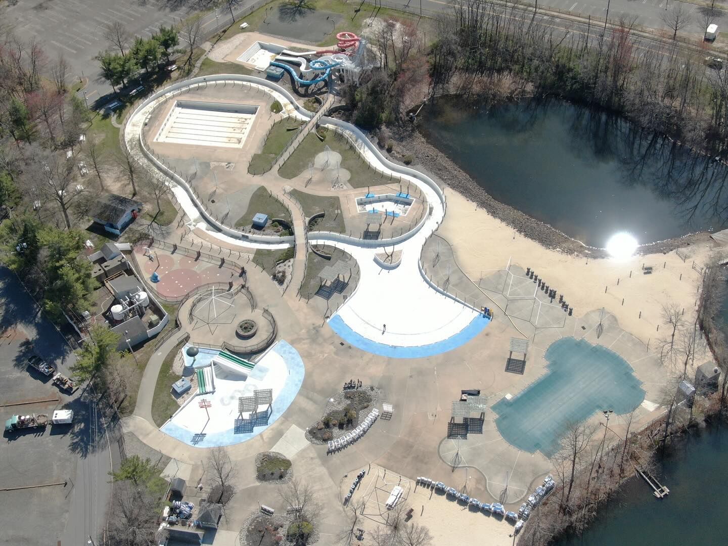 An aerial view of a water park with a large pool