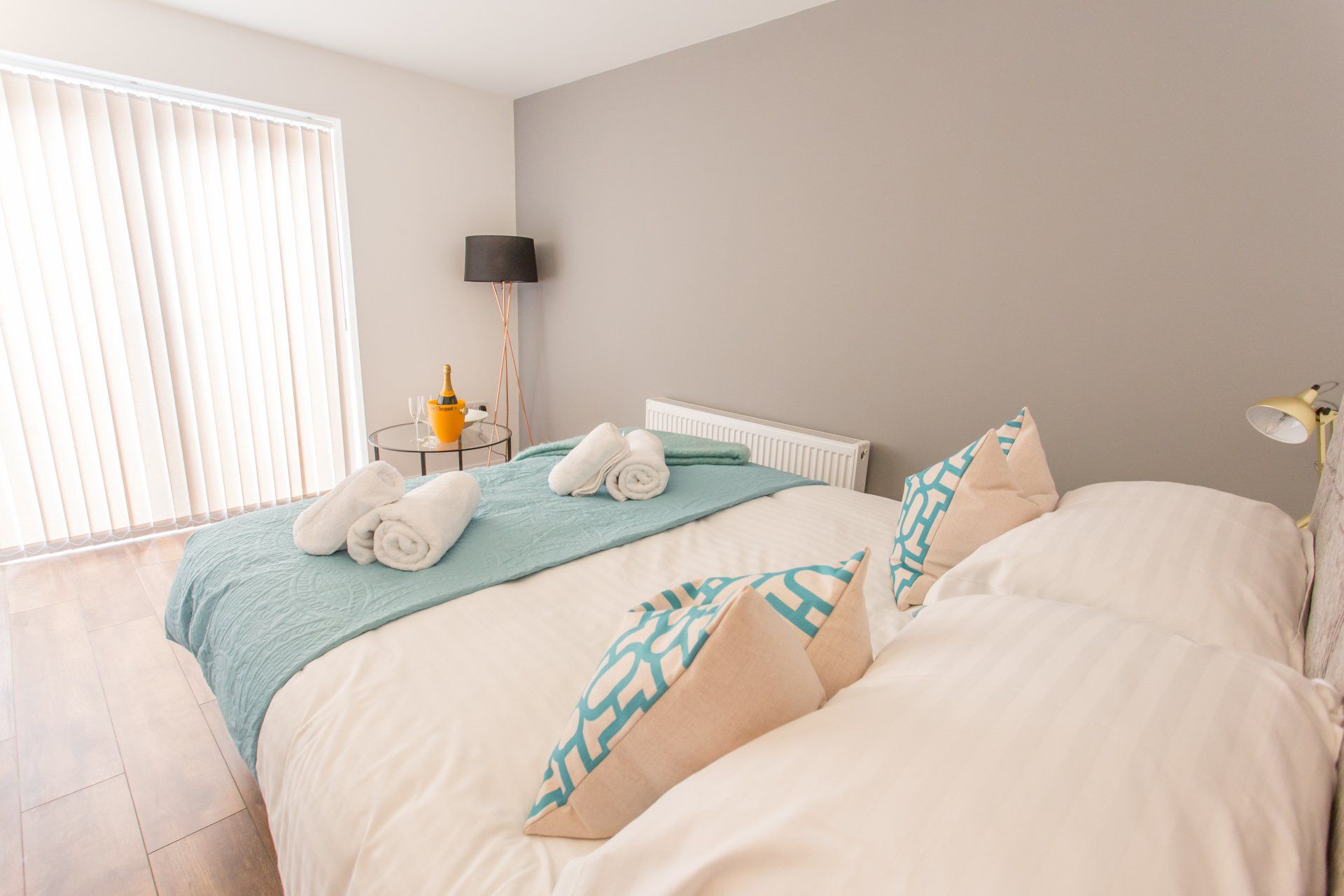 Comfortable bedroom featuring a double bed, bedside tables, and soft lighting.