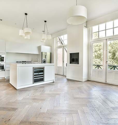 There is a large island in the middle of the kitchen.