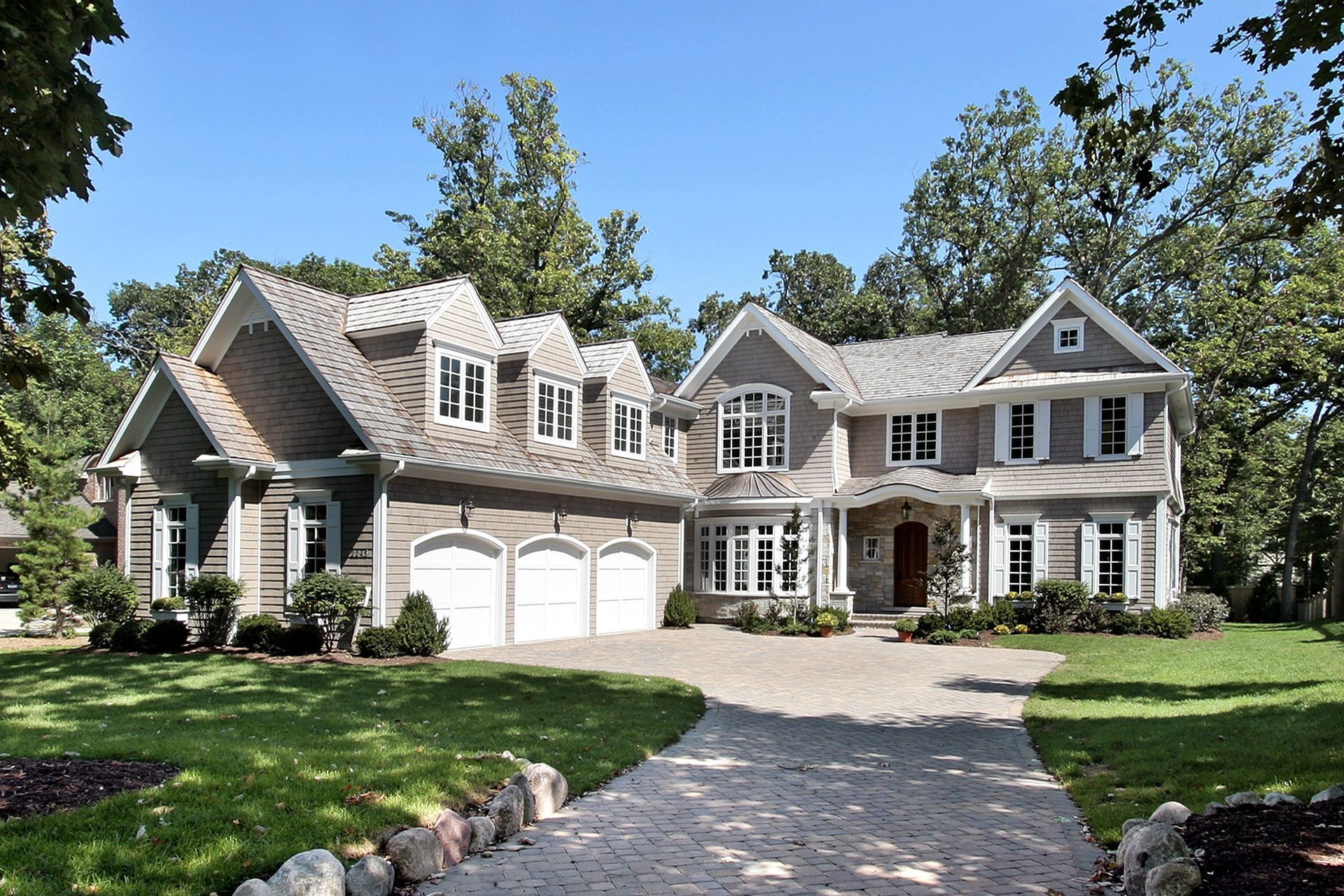 A large house with a driveway leading to it