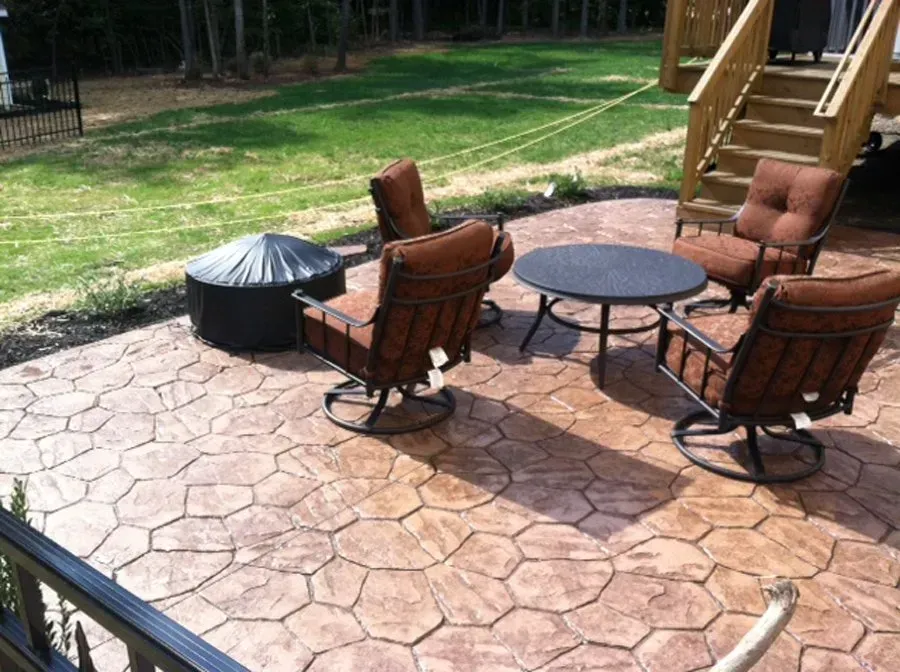 A patio with chairs, and table