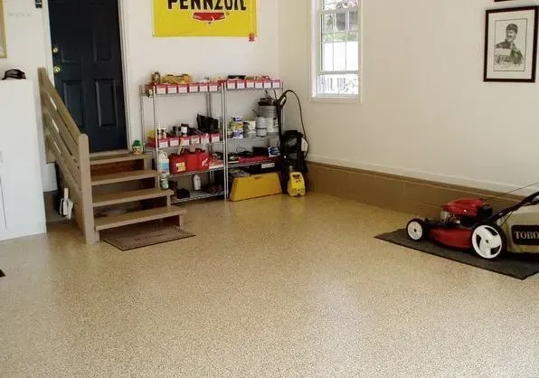 A garage with a pennzoil sign hanging on the wall