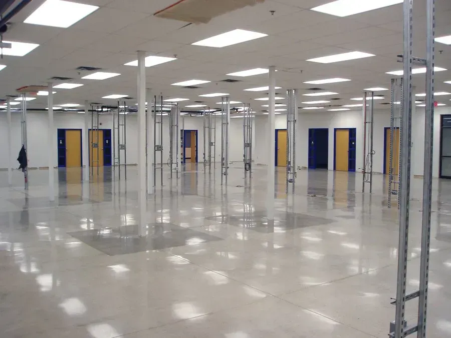 A large empty room with a lot of doors