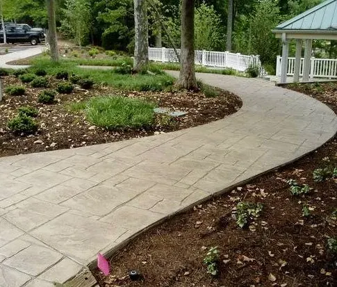 A concrete walkway with a gazebo