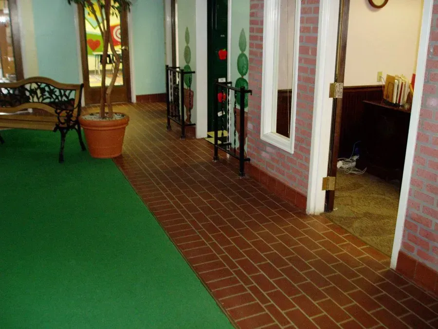 Brick floors and a green carpet