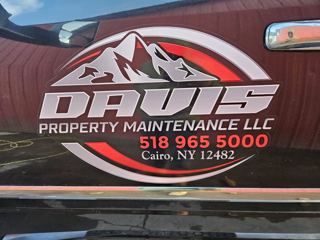 Logo for Davis Property Maintenance LLC featuring a mountain graphic, phone number 518-965-5000, and location in Cairo, NY.