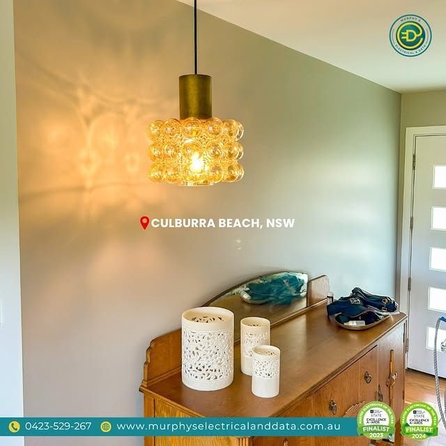 A mid-century modern light fixture illuminates a hallway in Culburra Beach, NSW, Australia.