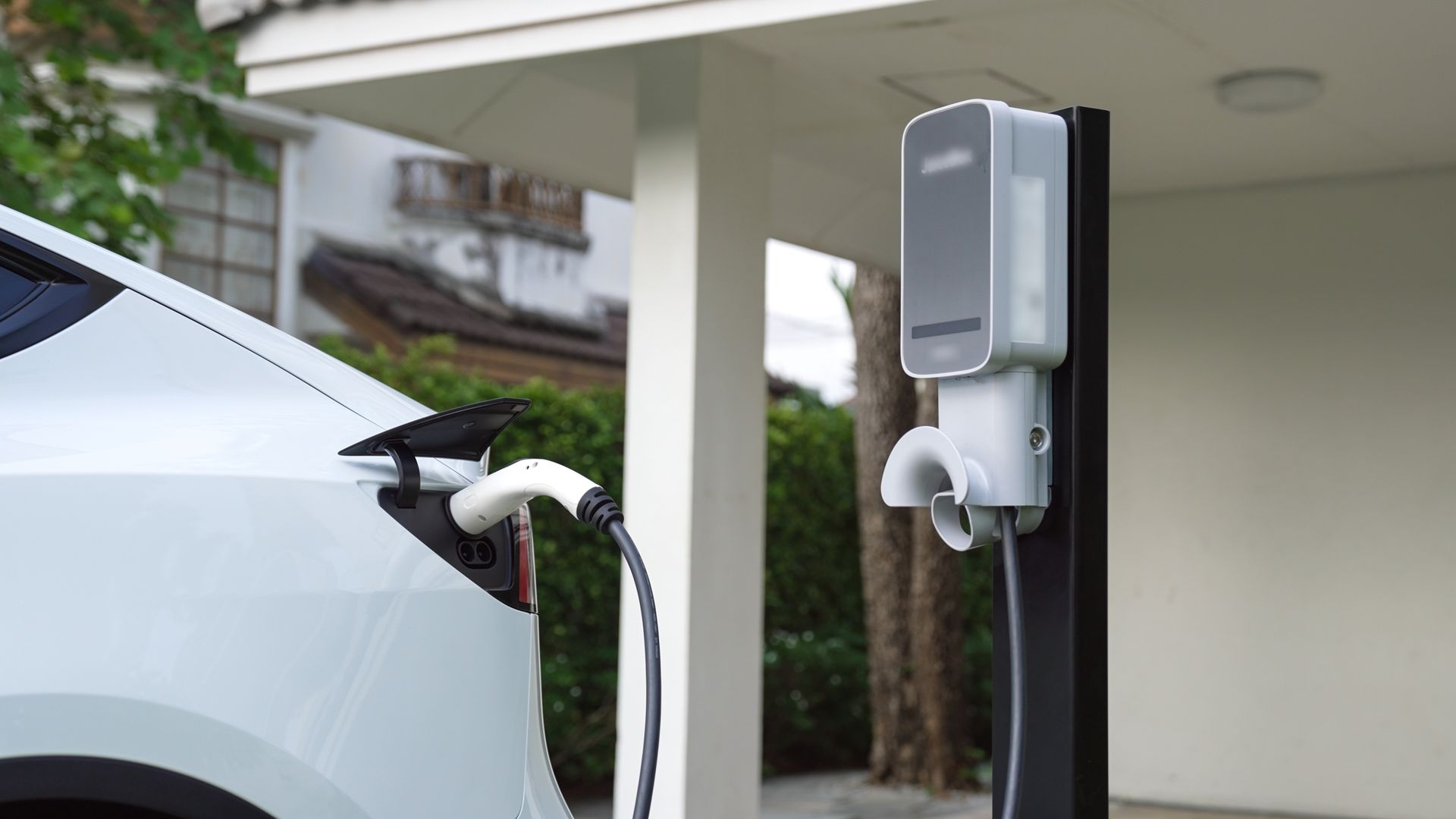 Construction site with metal framing for walls, floors, and ceiling. Concrete columns and exposed ductwork are visible.