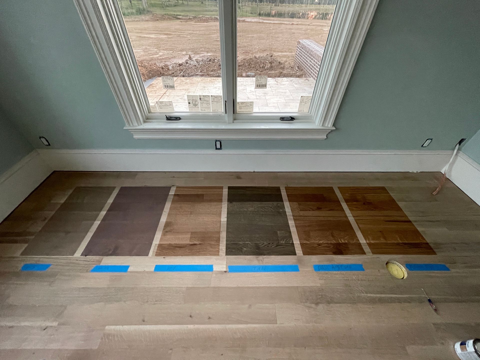 A room with a lot of wooden floors and a window