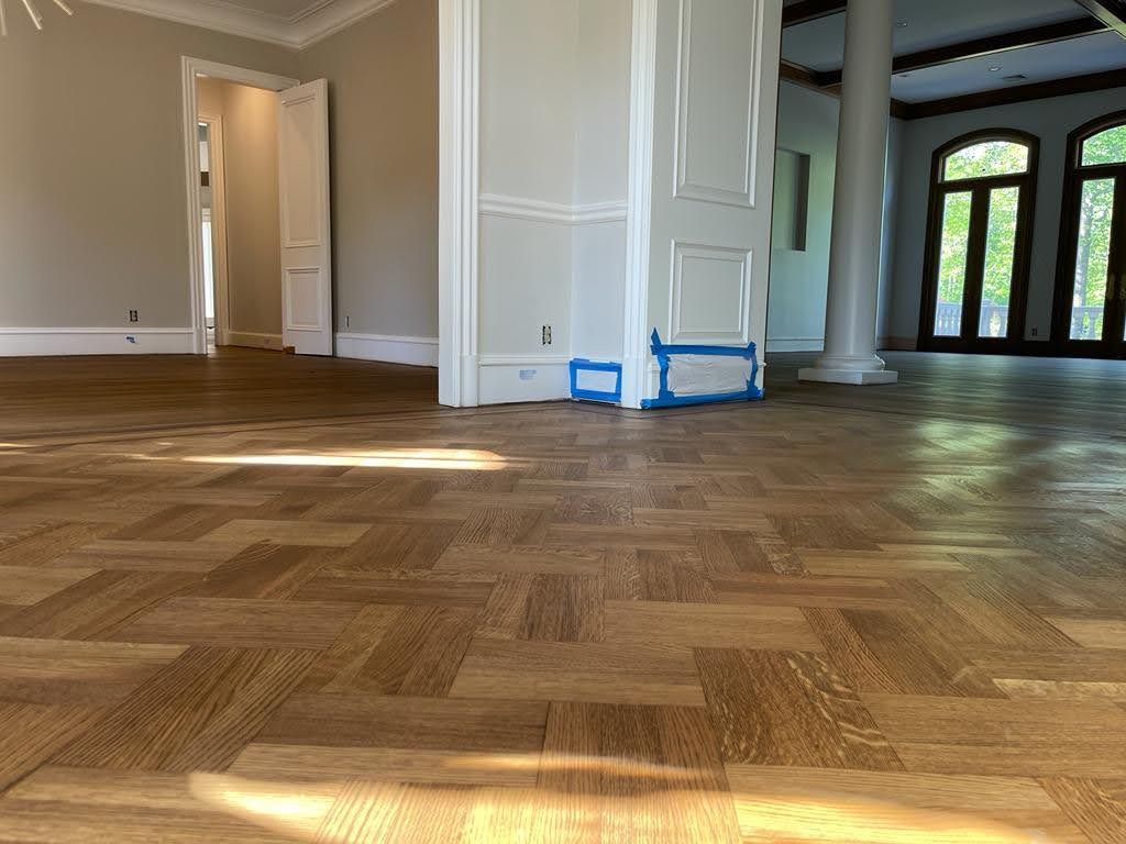 There is a wooden floor in the middle of the room.