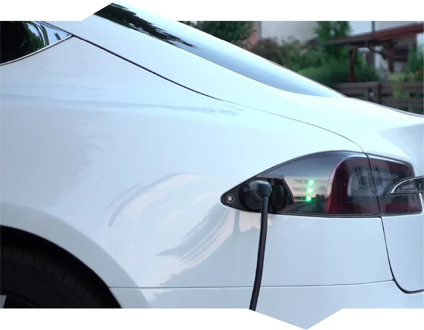 A person is opening a car door with a key.