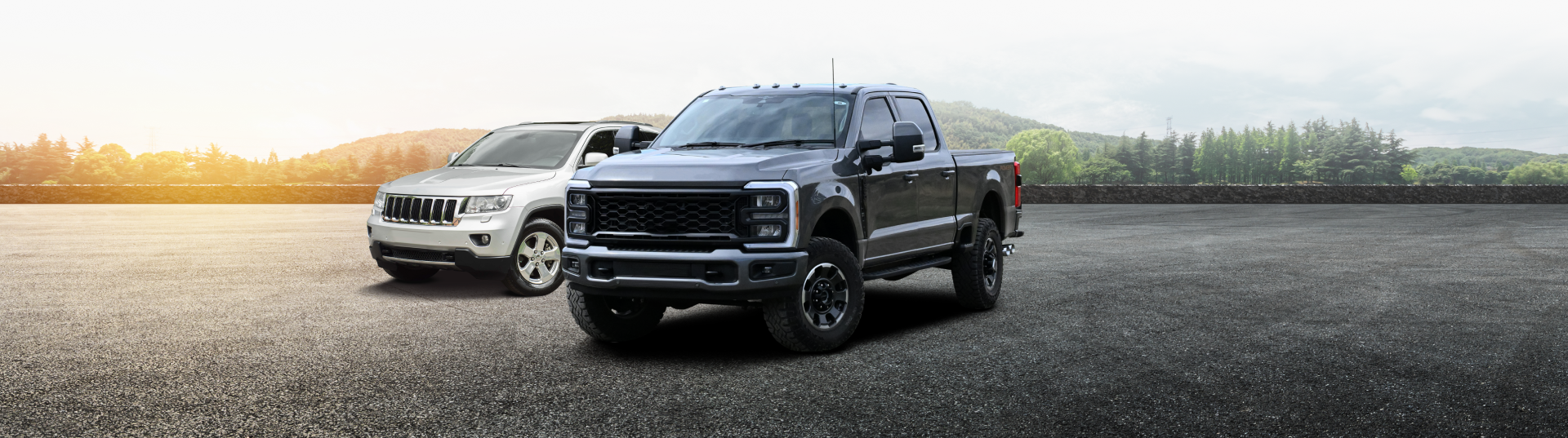 dark colored truck and silver suv on road | Bonnettes Automotive Inc