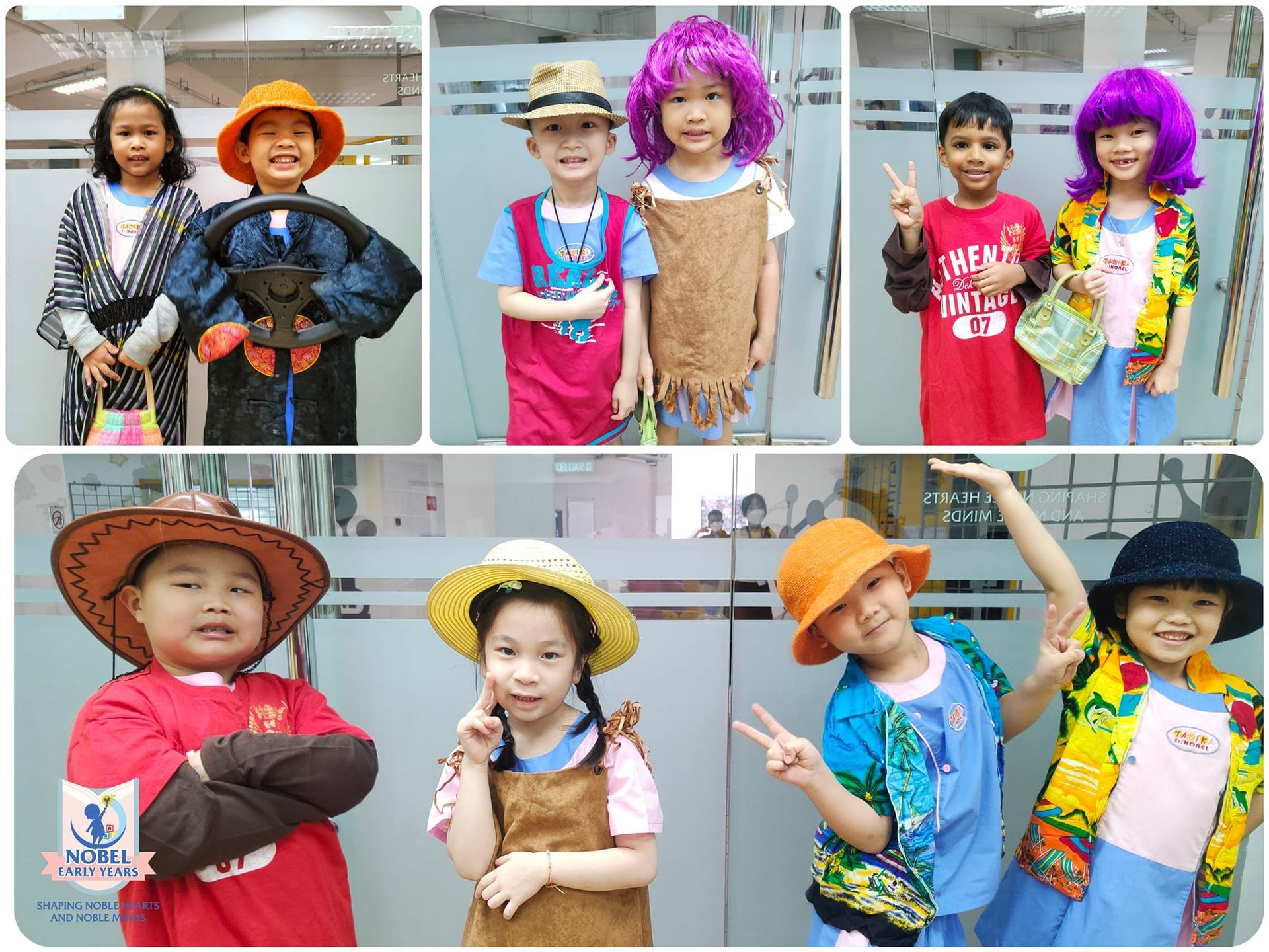Children in costumes and hats, posing for pictures against a glass wall.