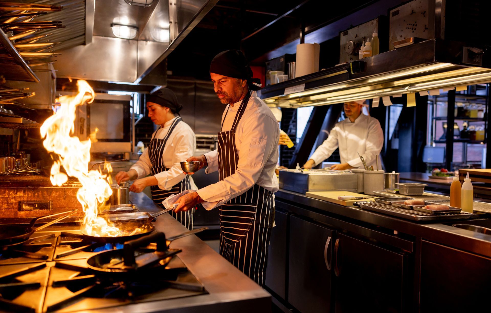 Chef Cooking at a Restaurant and Flaming the Food  — North Randall, OH — Mack Plumbing