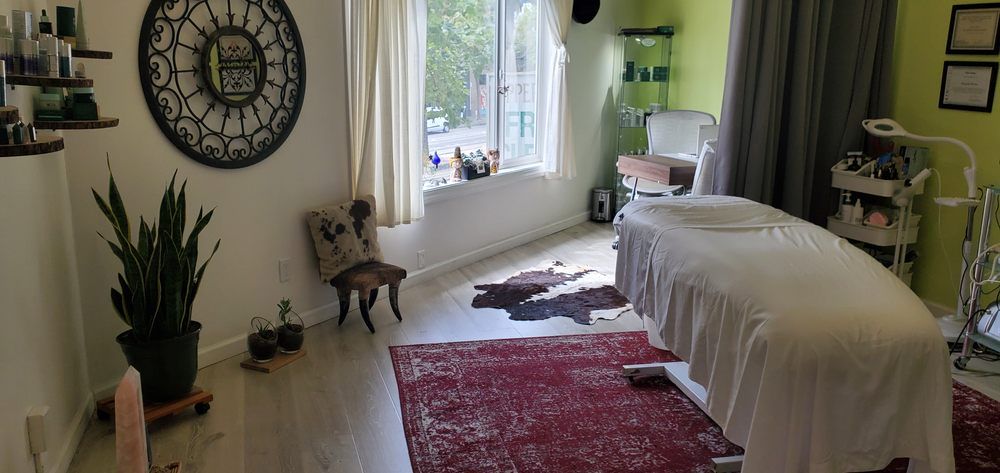 There is a massage table in the middle of the room.