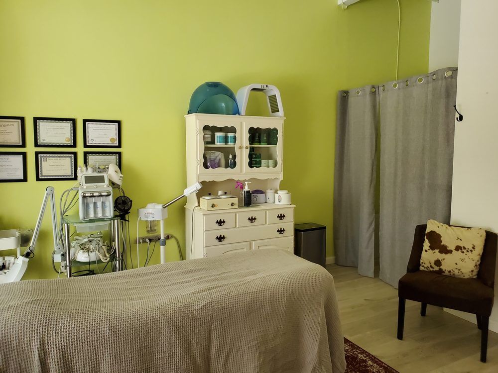 A room with a bed and a chair in it