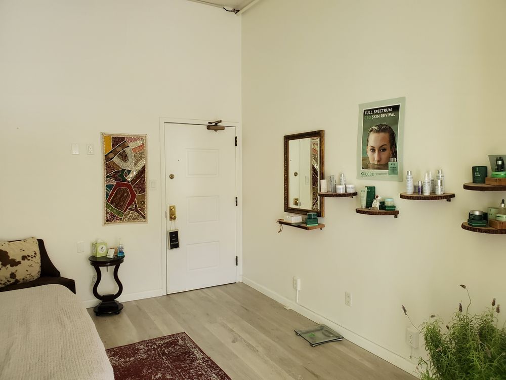 There is a picture of a woman on the wall in the room.