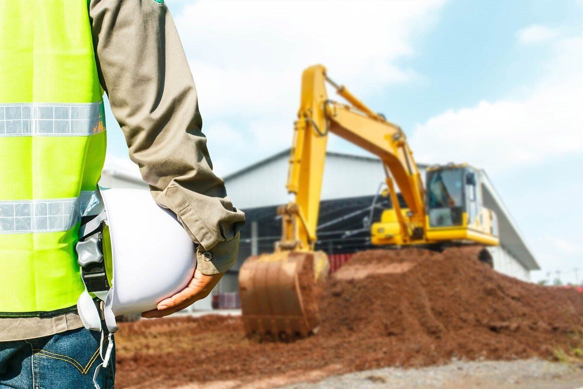Operator With Safety Equipment At Construction — Equipment Hire In Rockhampton, QLD