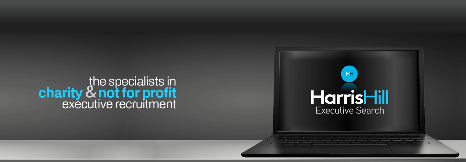 Laptop with Harris Hill logo; text reads 