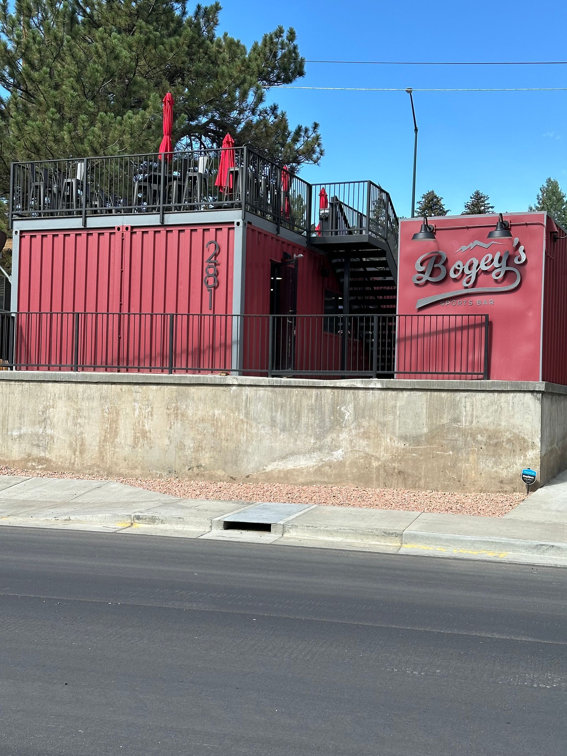 A red building with the word dogs on it