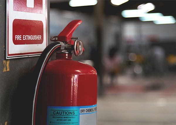 Closeup Red Fire Extinguisher — Milwaukee, WI — Accurate Recharge and Fire Suppression