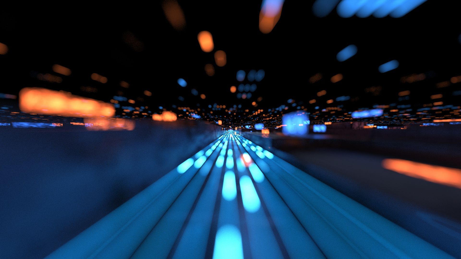 A blurry picture of a tunnel with a lot of lights coming out of it.