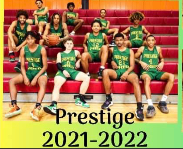 The prestige basketball team is sitting on the bleachers