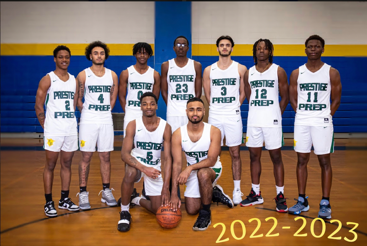 A group of basketball players are posing for a picture on a court.