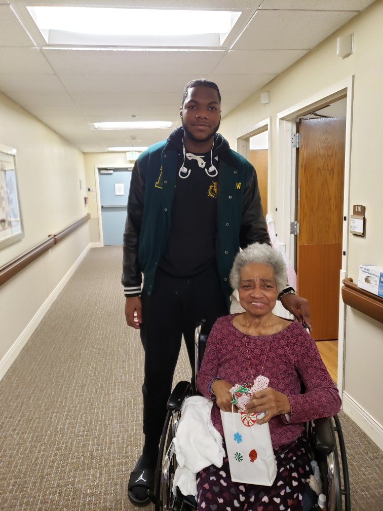 Student Athlete With a Happy Elder in Wheelchair