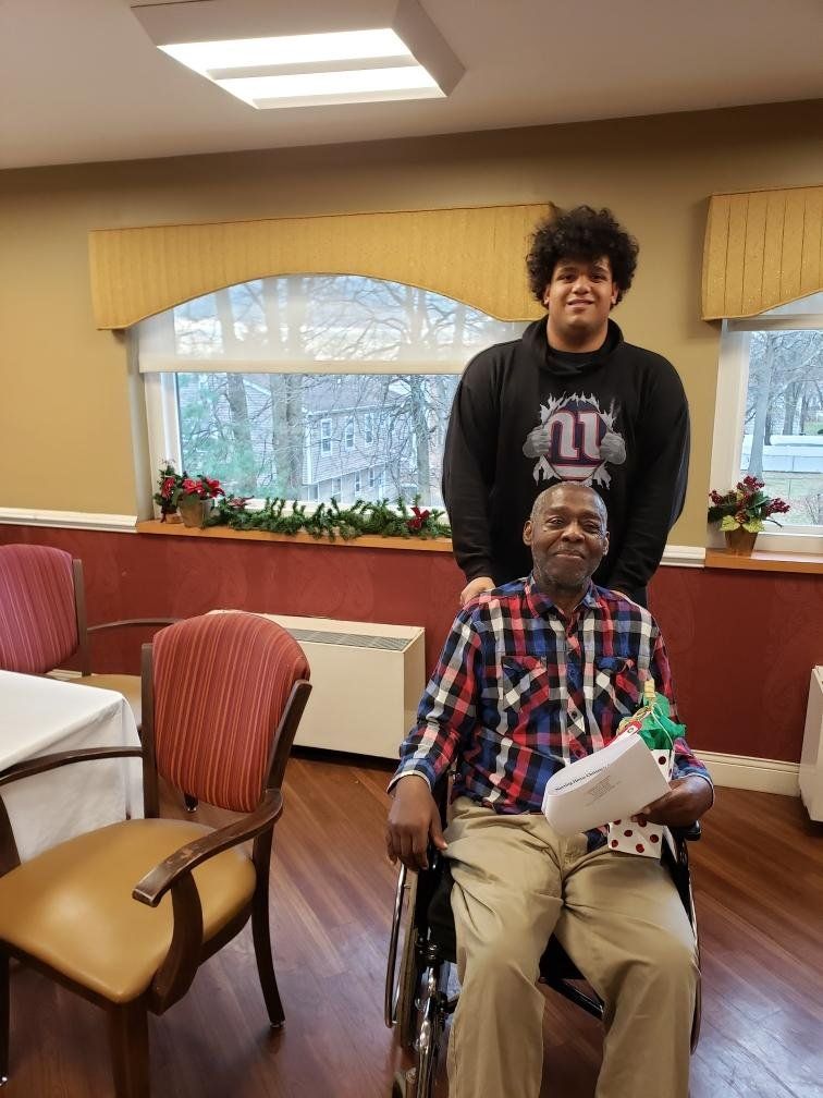 Student Athlete With Happy Old Man