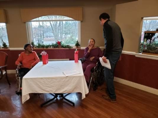 Coach Talking to Elderly