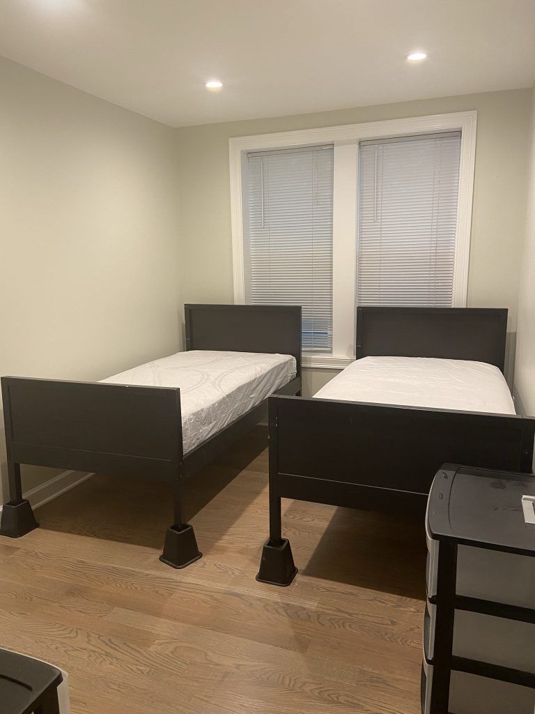 Nice and Clean Bedroom With Two Beds