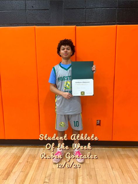 A player of the week is holding a piece of paper