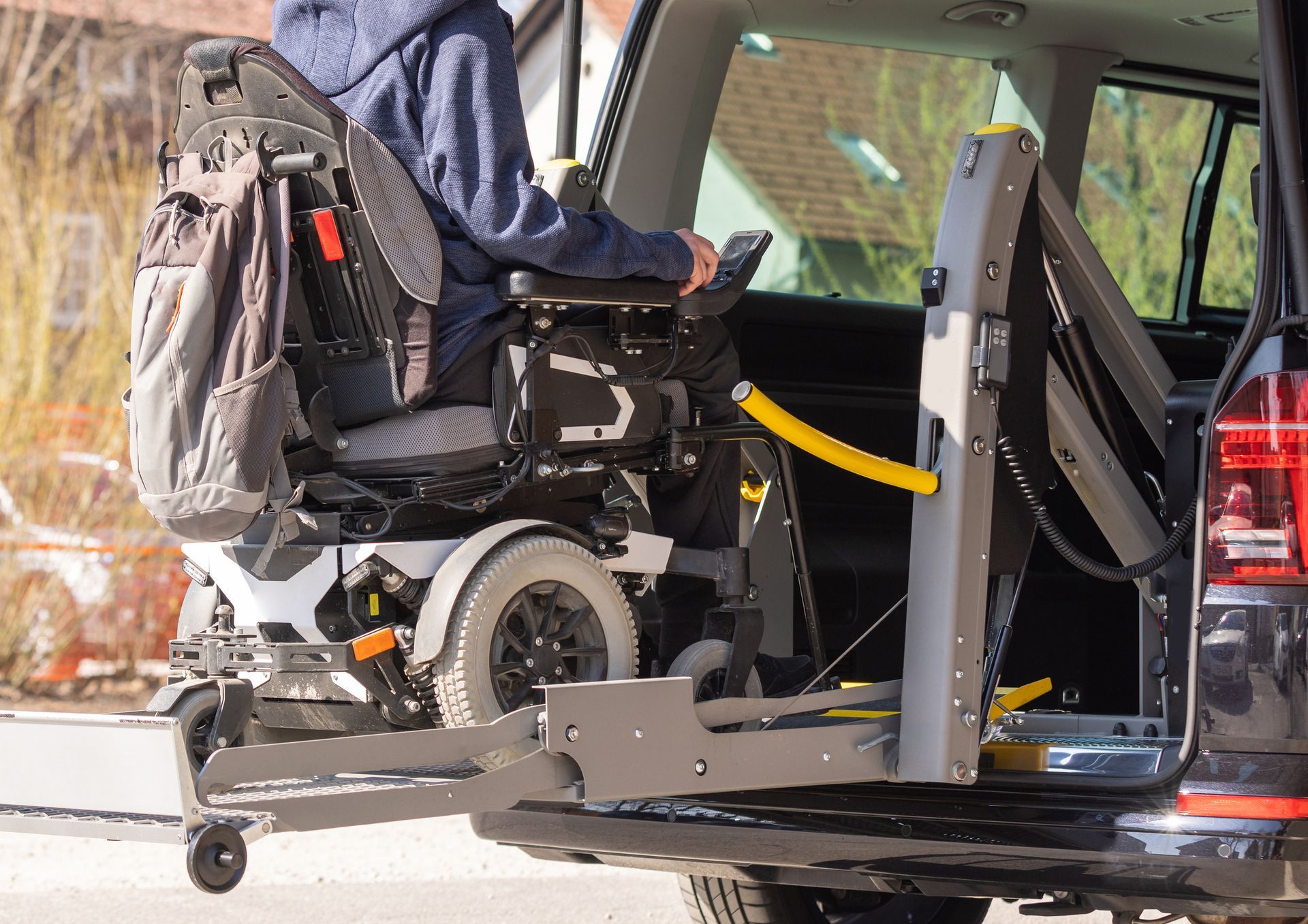 Man in wheelchair loading into van