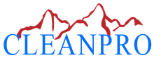 A blue and red logo for cleanpro with mountains in the background.