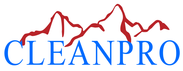 A blue and red logo for cleanpro with mountains in the background.