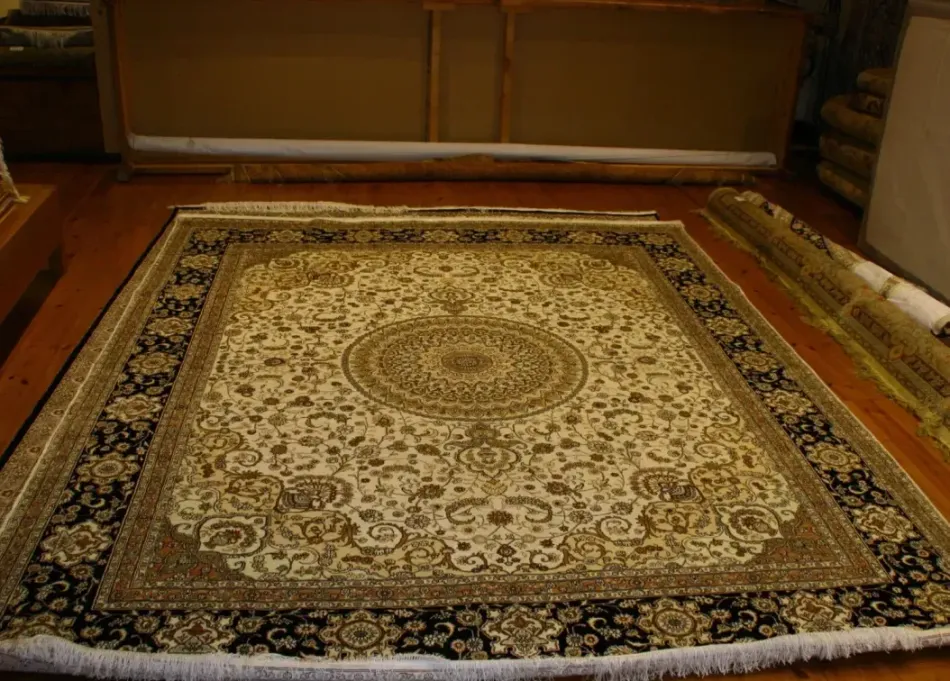 A rug is sitting on a wooden floor in a room.