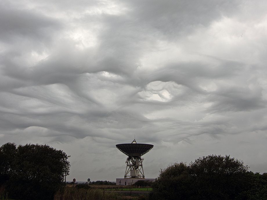 Photo showing Asperitas clouds over Goonhilly's Ghy6 Deep Space Antenna